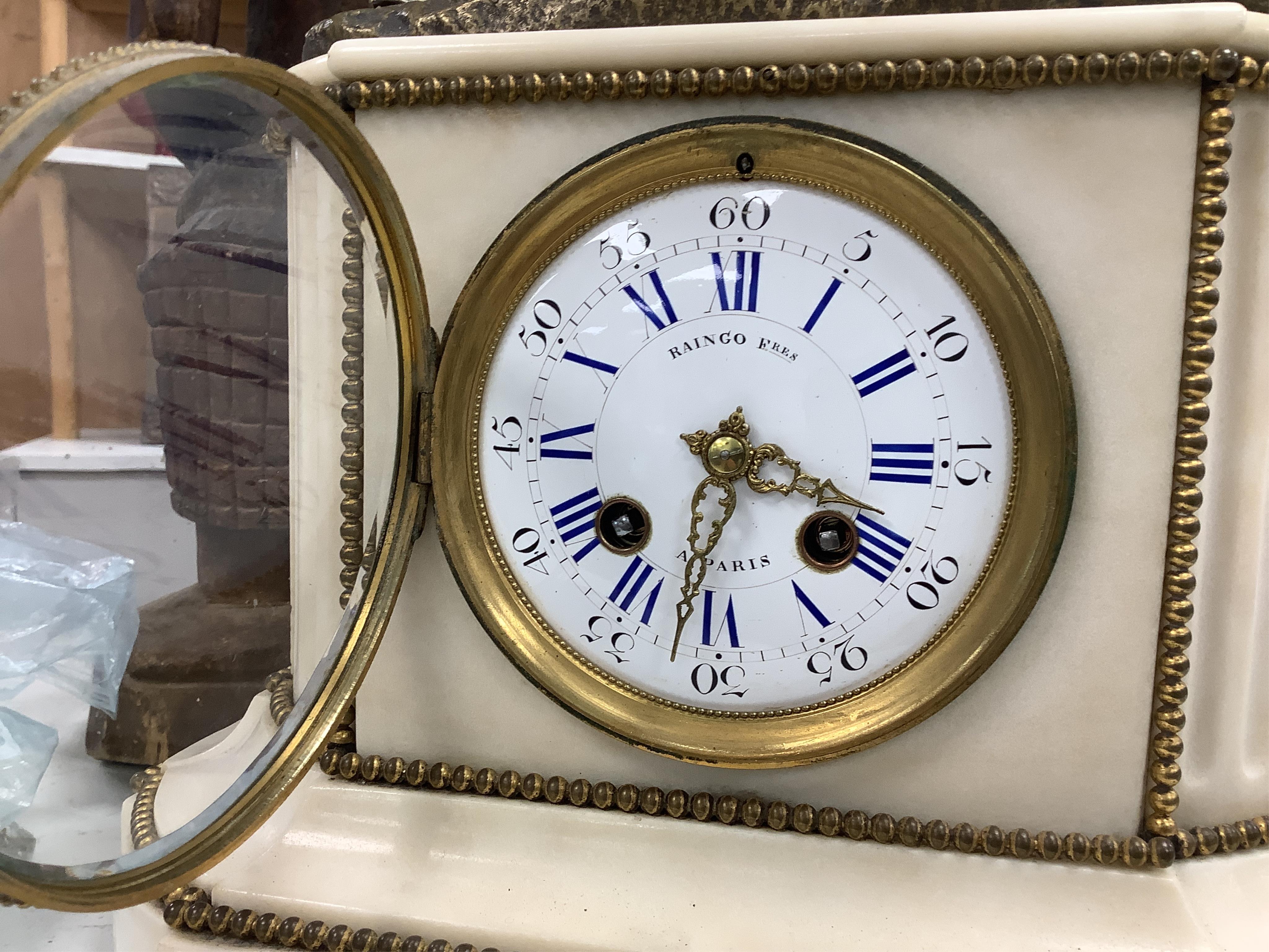 A late 19th century French bronze figural mounted marble mantel clock, 34cm